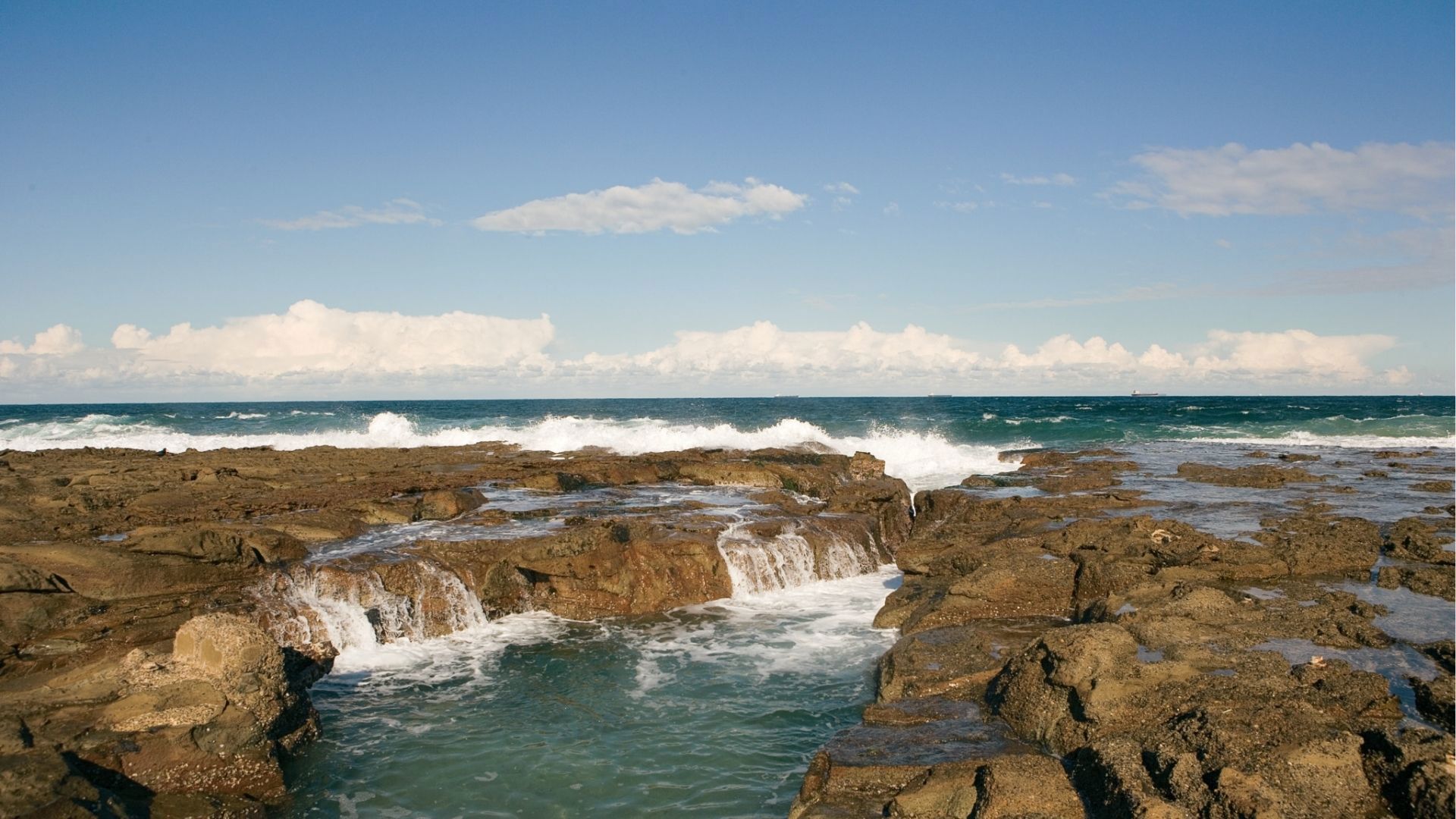 Rocky sea with waves crashing,