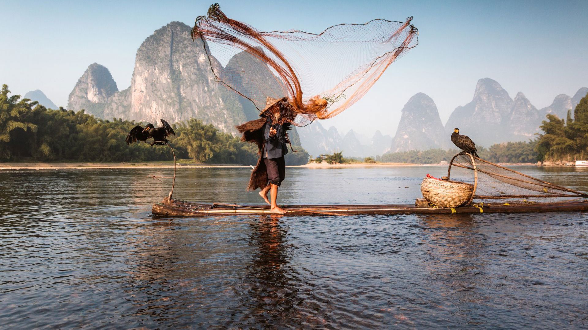A fisherman on the Li River in China. Image Credit: Getty