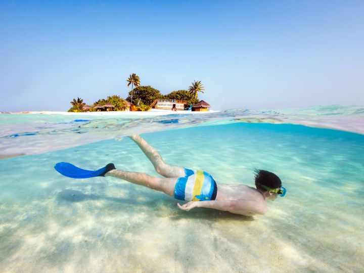 Boy snorkelling in ocean