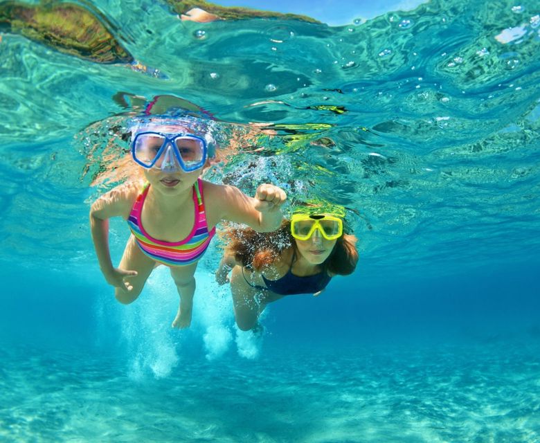 Underwater View Of Kids Snorkelling