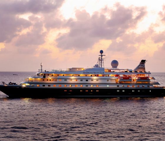 SeaDream Yacht cruising at sunset