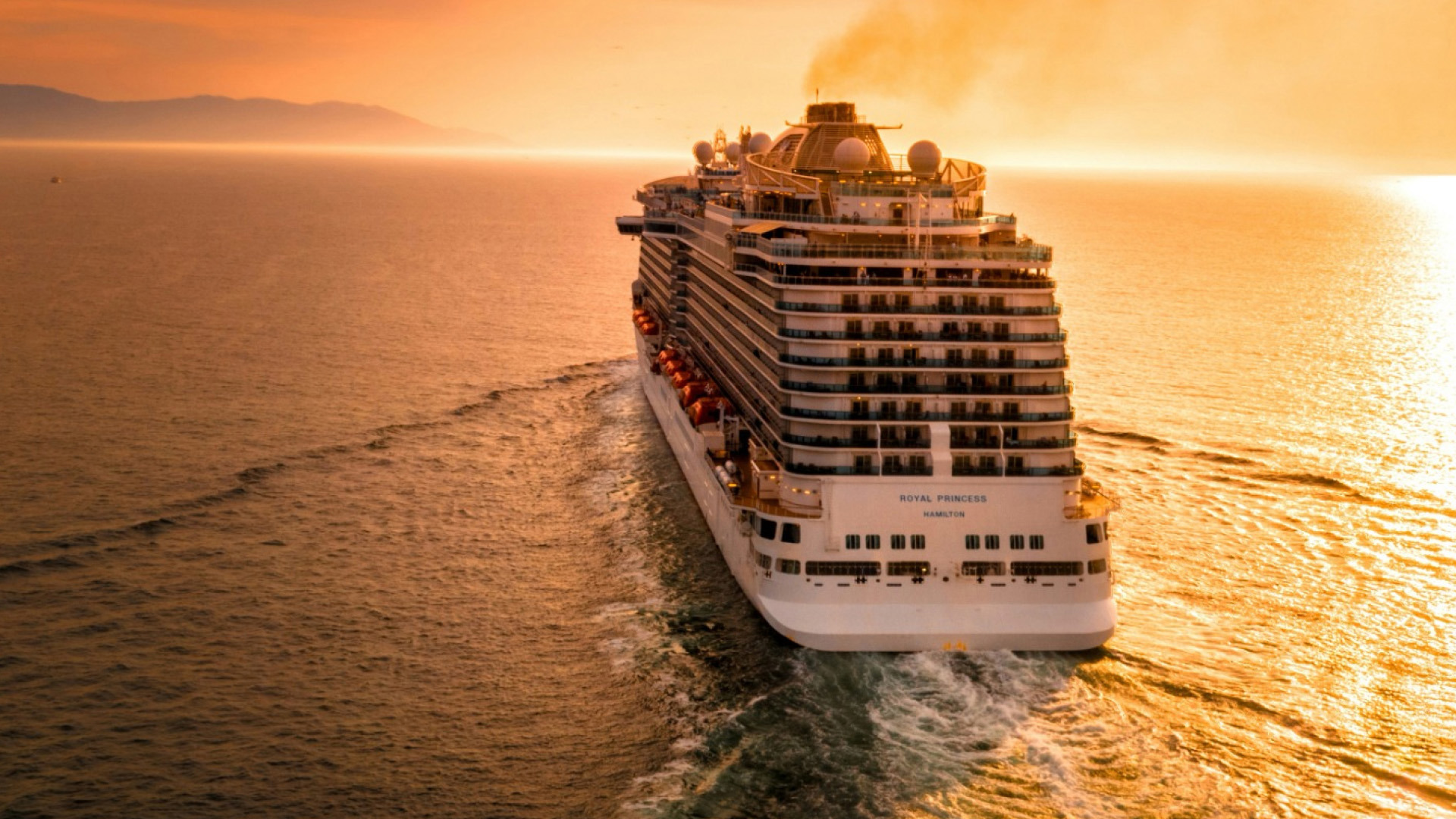 Cruise ship sailing into the sunset