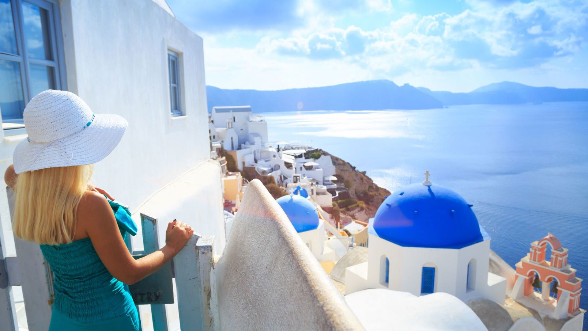 Wake up to cliffs, colour and the Aegean at your feet. Image credit: Getty