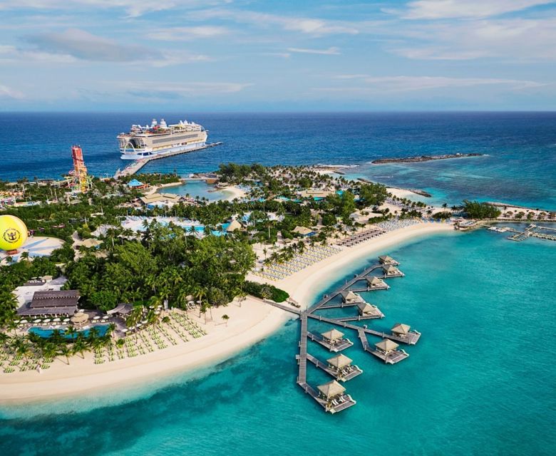 Icon of the Seas, ship seen in background docked at Perfect Day at CocoCay Island