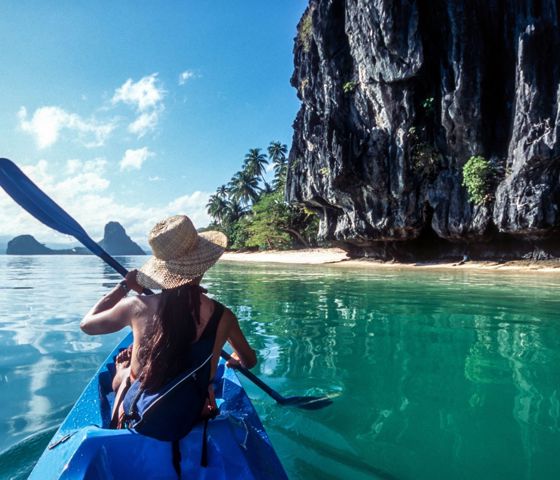 Woman kayaking in the ocean