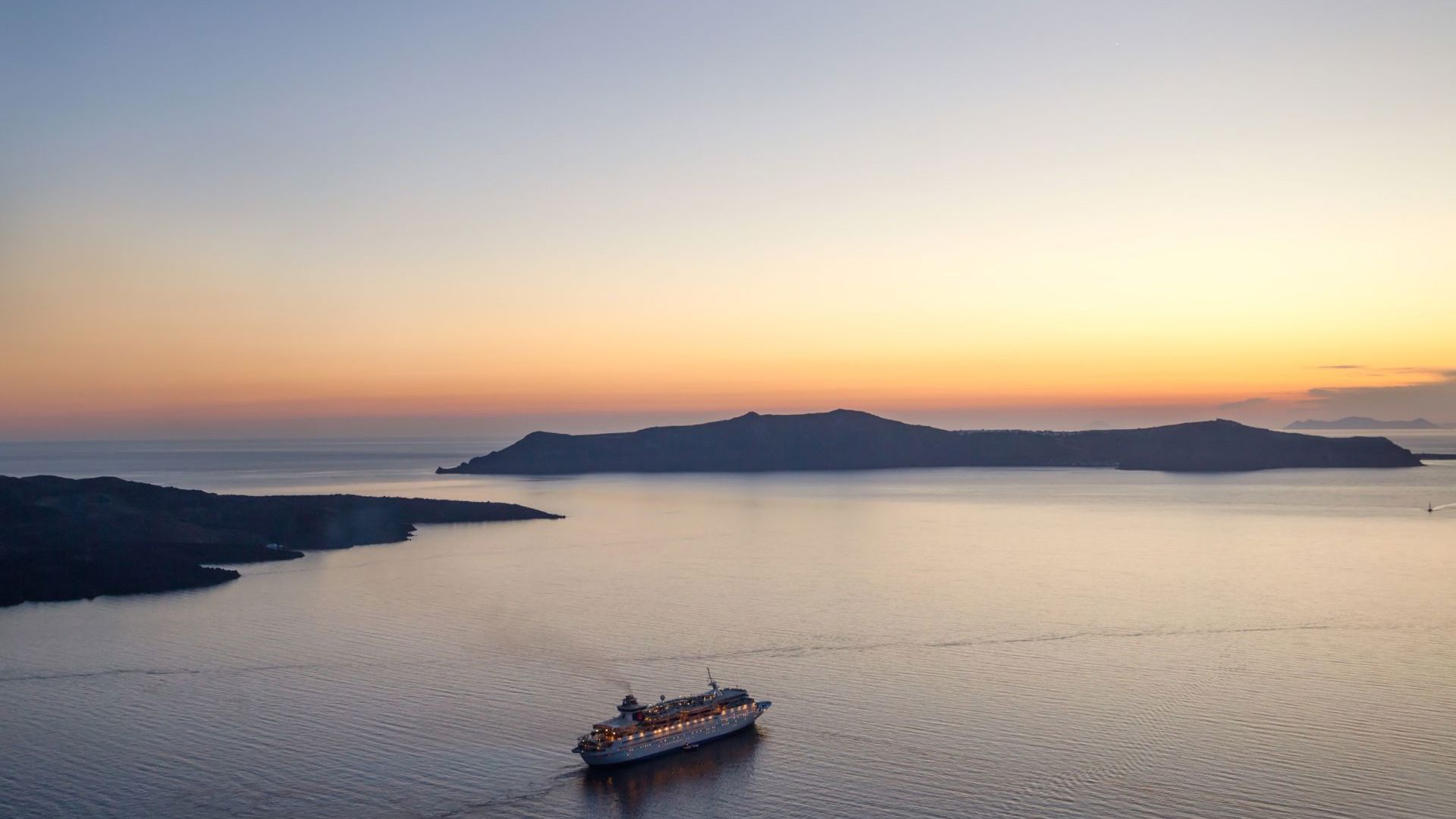Sun setting over Santorini, Greece - Image credit: Getty Images