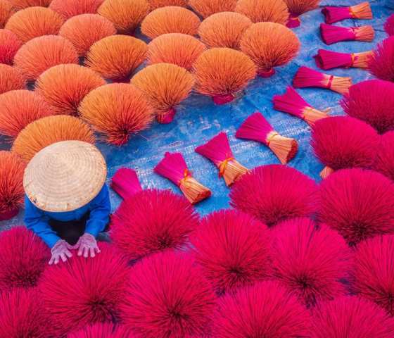 Vietnam Worker Drying Traditional Incense