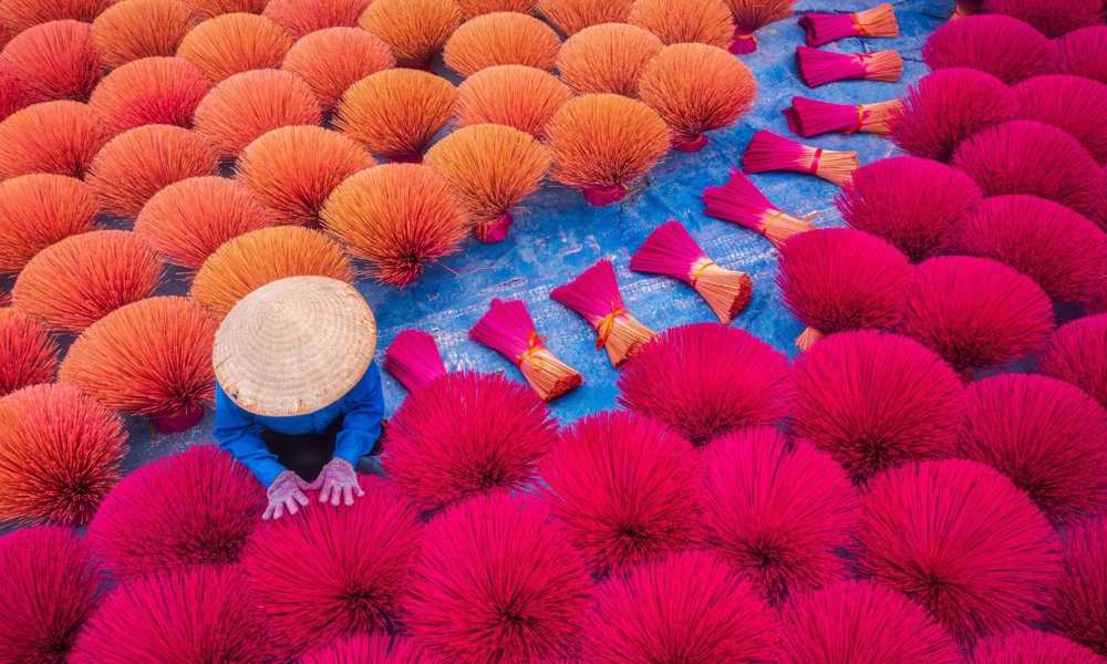 Vietnam Worker Drying Traditional Incense