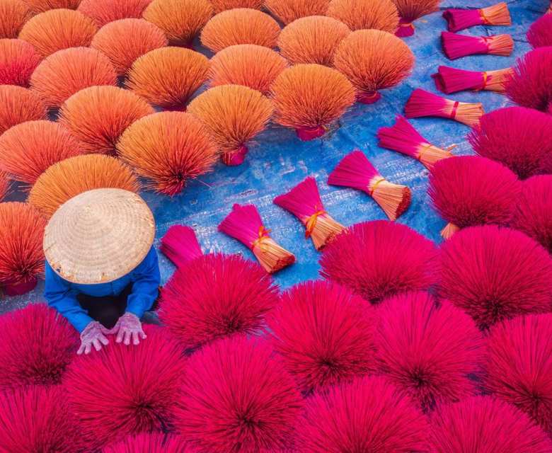 Vietnam Worker Drying Traditional Incense
